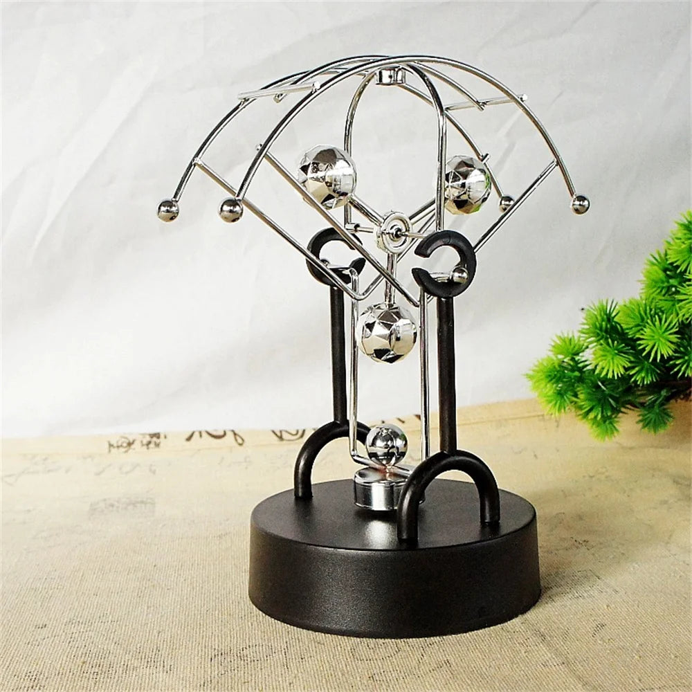 Metal Perpetual Motion Parachute desk ornament. Add some fascination to your living or study space!