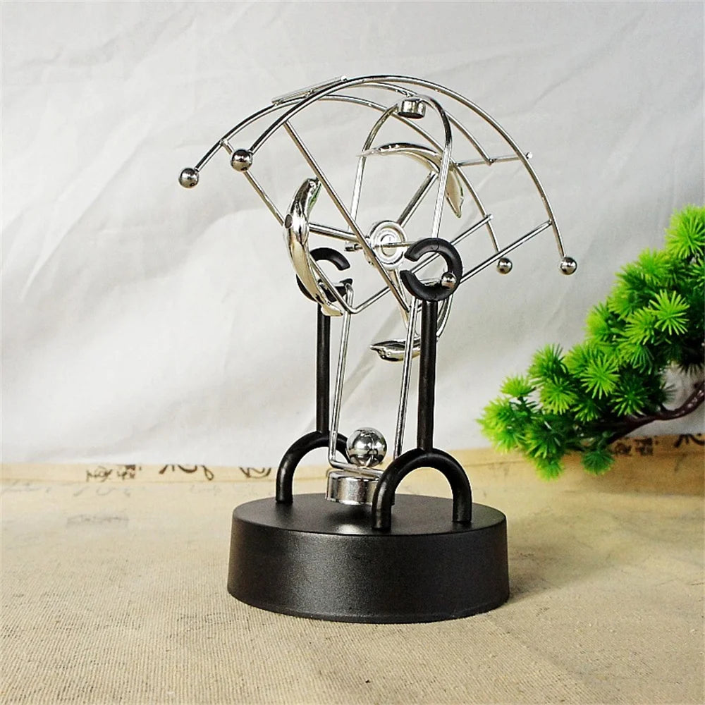 Metal Perpetual Motion Parachute desk ornament. Add some fascination to your living or study space!