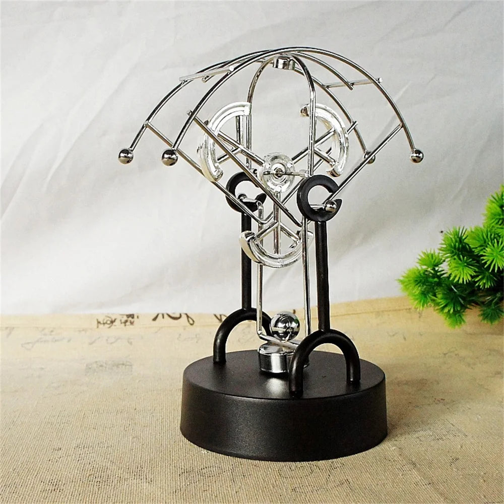 Metal Perpetual Motion Parachute desk ornament. Add some fascination to your living or study space!
