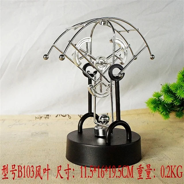 Metal Perpetual Motion Parachute desk ornament. Add some fascination to your living or study space!