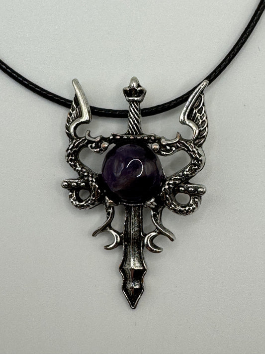 Dragon and sword pendant with amethyst centre