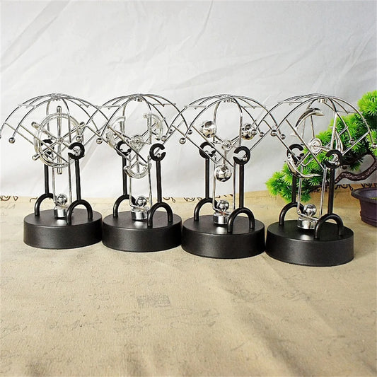 Metal Perpetual Motion Parachute desk ornament. Add some fascination to your living or study space!